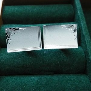 Silver colored cufflinks